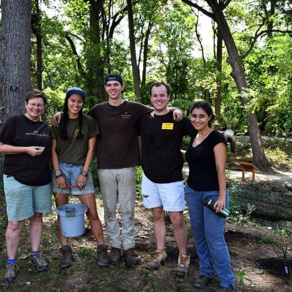 Arboretum Director Claudia Kent (left) and volunteers at the planting event.