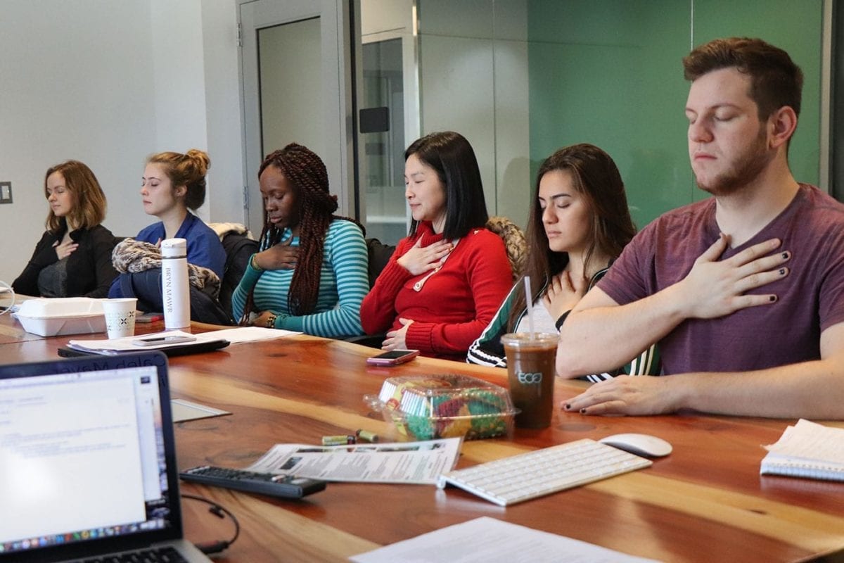 Shu-wen Wang's "Stress and Coping Class" practices breathing exercises.