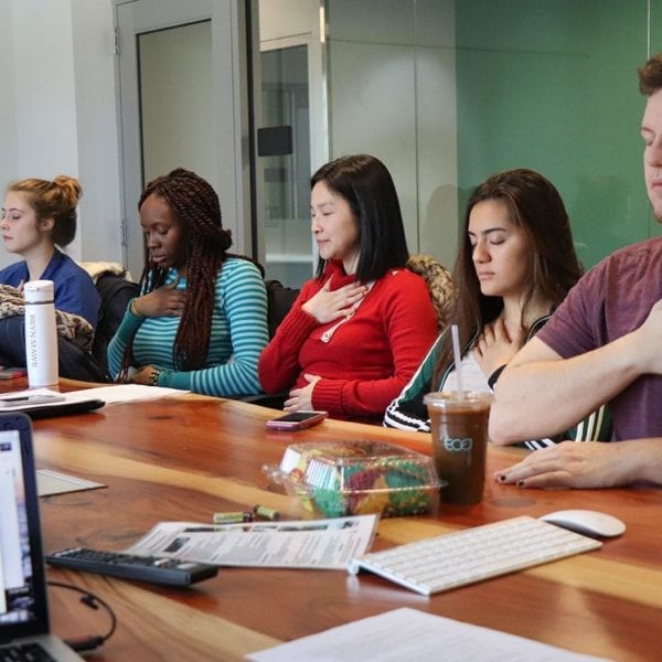 Shu-wen Wang's "Stress and Coping Class" practices breathing exercises.