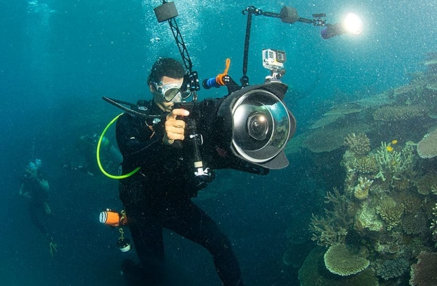 A film still from Chasing Coral showing Director Jeff Orlowski filming on the Great Barrier Reef.