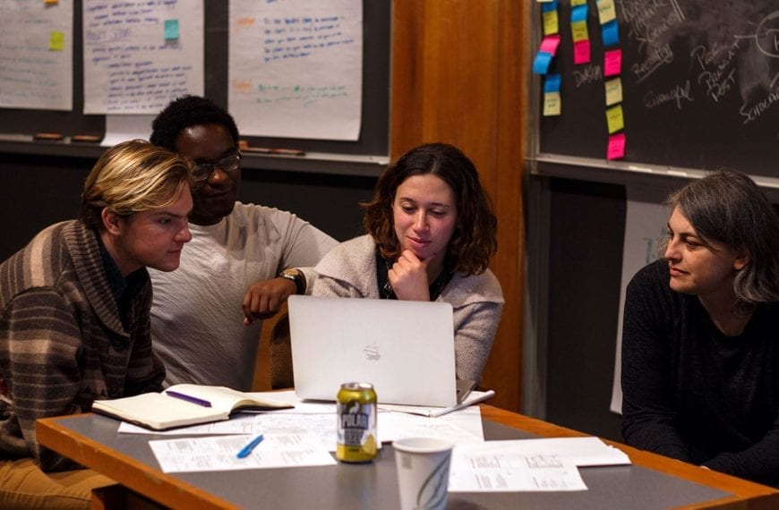 Students collaborating with a local entrepreneur to refine their ideas.