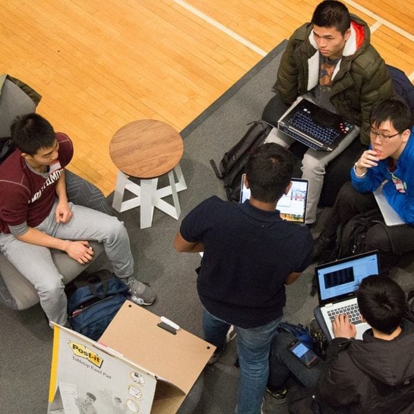 Teams work on their app ideas.