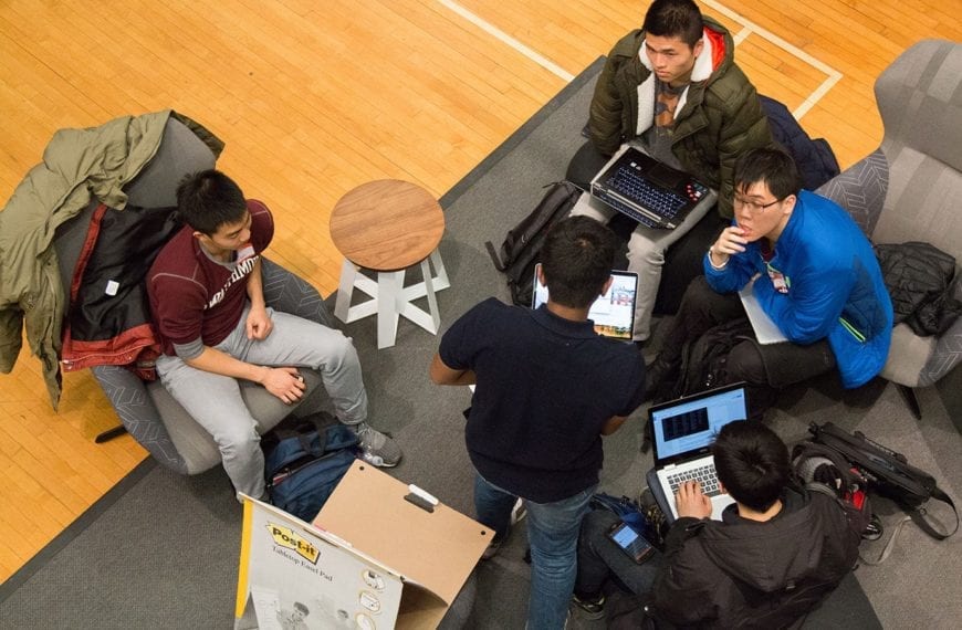 Teams work on their app ideas.