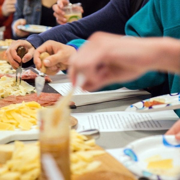 Students trying the different cheeses and meats