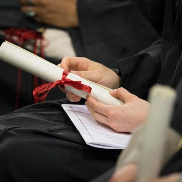 Student's hands holding a diploma