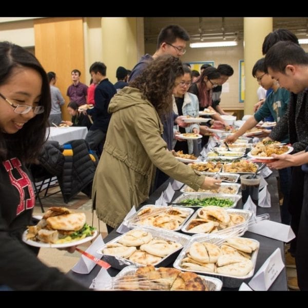 Students load their plates with Chinese food