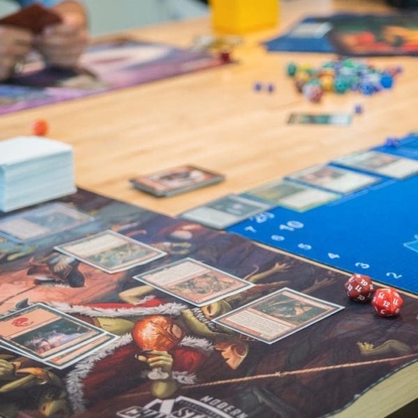 Magic cards and board at a Planeswalkers for Diversity meeting