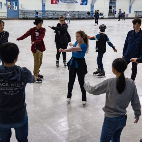 Anna Fiscarelli-Mintz '22 teaching members of the Figure Skating Club some tricks.