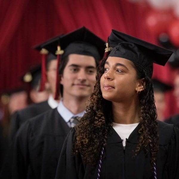 Students rising to get their degrees