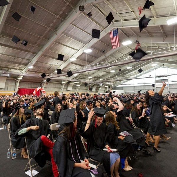 Hats in the air at the Commencement Ceremony in the Field House