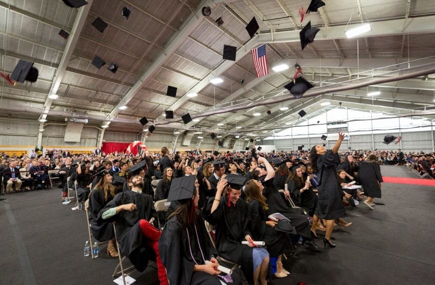 Hats in the air at the Commencement Ceremony in the Field House