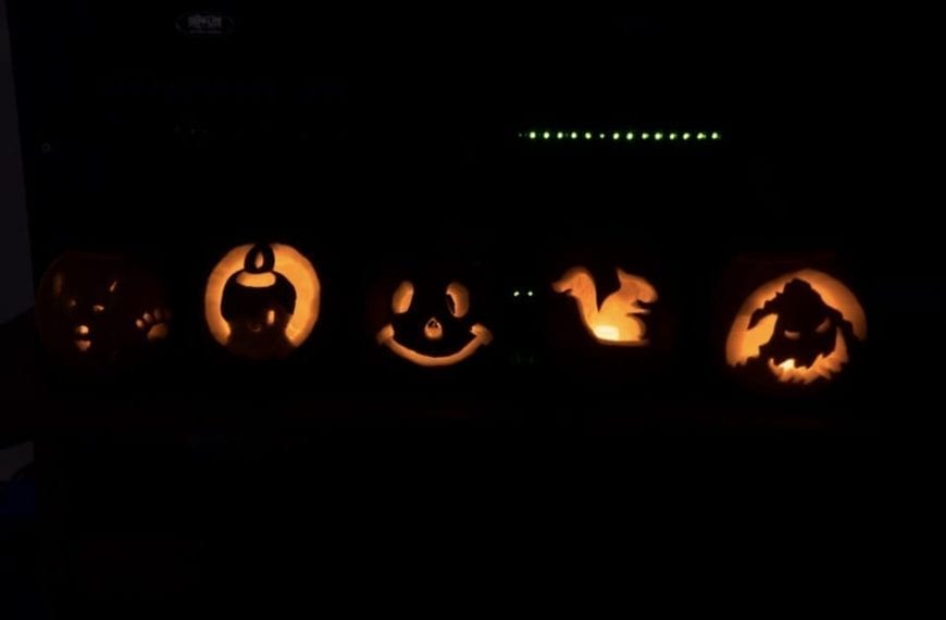 Jack-o-lanterns lit up in the dark