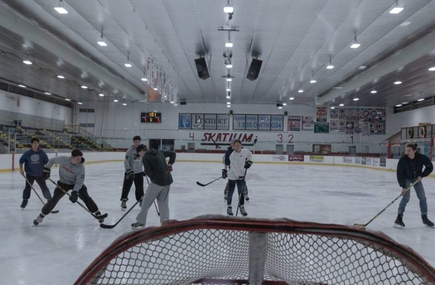 The team on the ice heading toward the goal