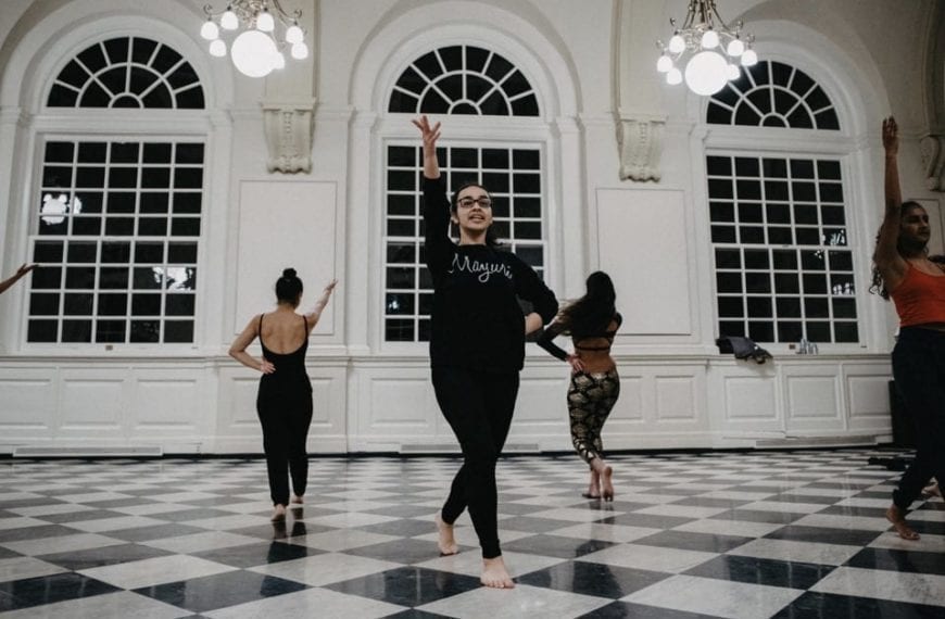 The South Asian fusion dance group practices in Founders Great Hall