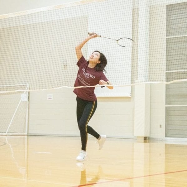 a student playing badminton