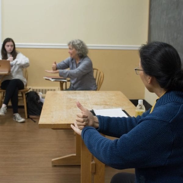 Professors Napoli and Huang practice ASL in their class