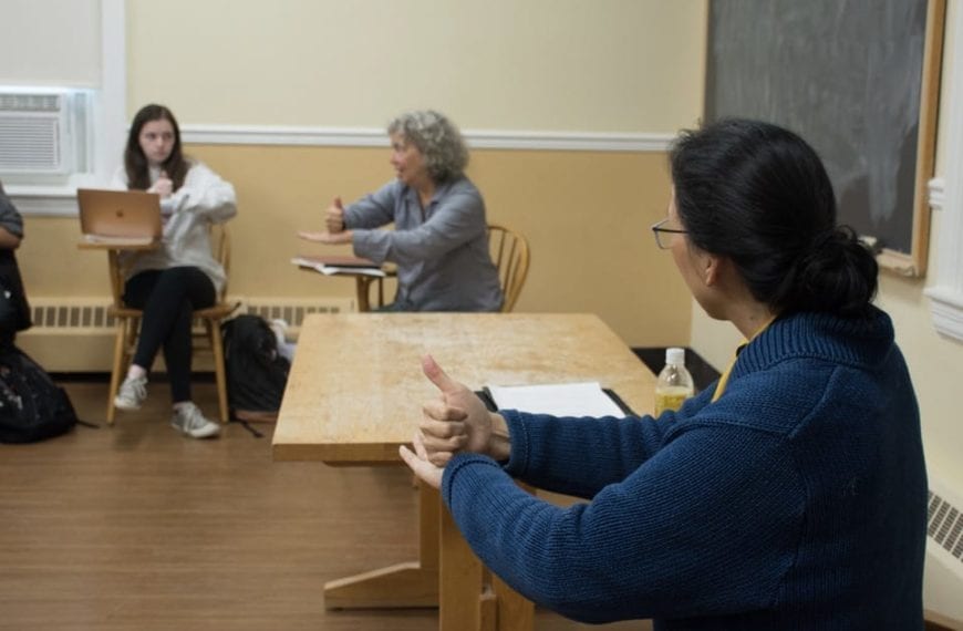 Professors Napoli and Huang practice ASL in their class