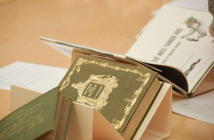 Books on display include "Peter and Wendy" and "Where The Wild Things Are"