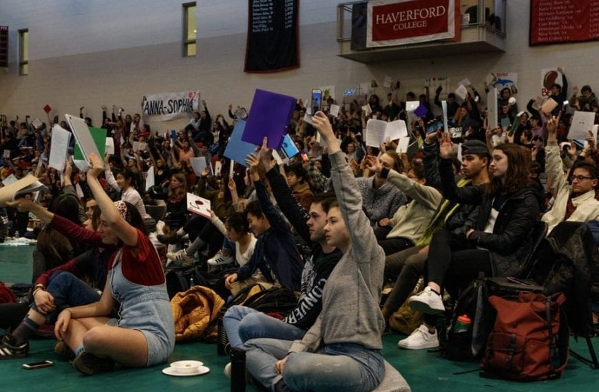 Students vote (by holding up colorful packets) on opening the Honor Code for ratification at Plenary.