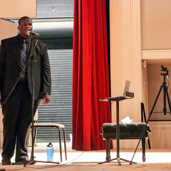 Keith sings on the stage of Marshall Auditorium