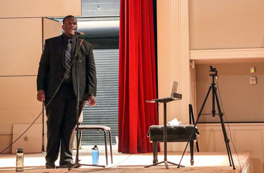Keith sings on the stage of Marshall Auditorium