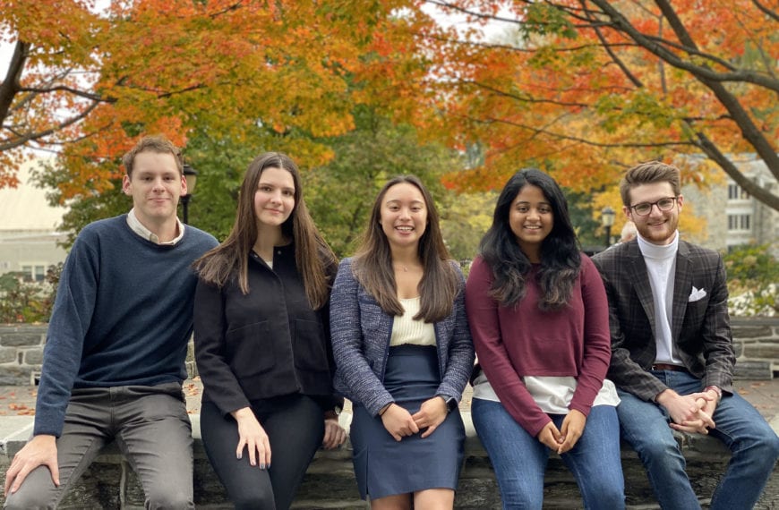 The club's leadership team poses in business casual dress