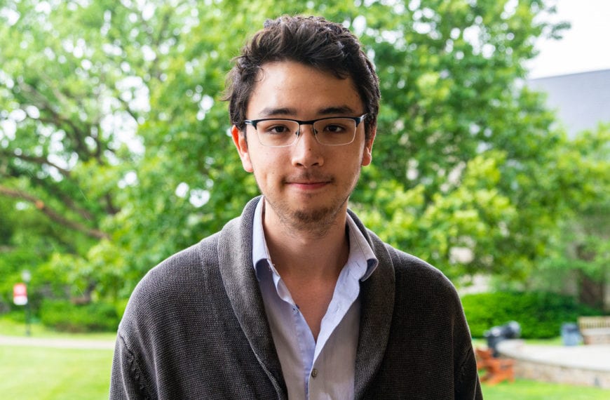 Headshot of Jonathan Sudo in front of trees.