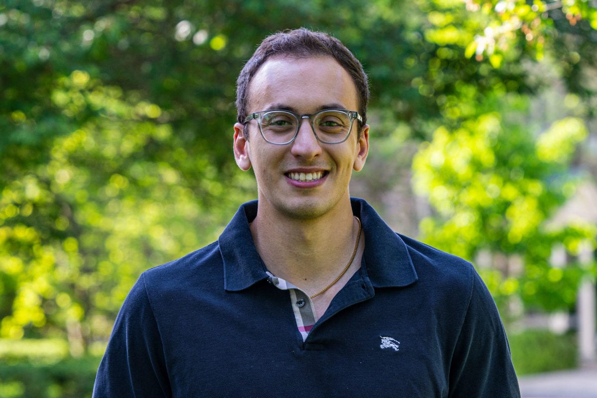 Headshot of Andrew Lummus in front of trees.