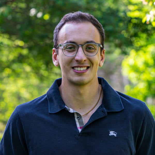 Headshot of Andrew Lummus in front of trees.