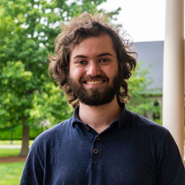 A headshot of Ethan on founders porch.