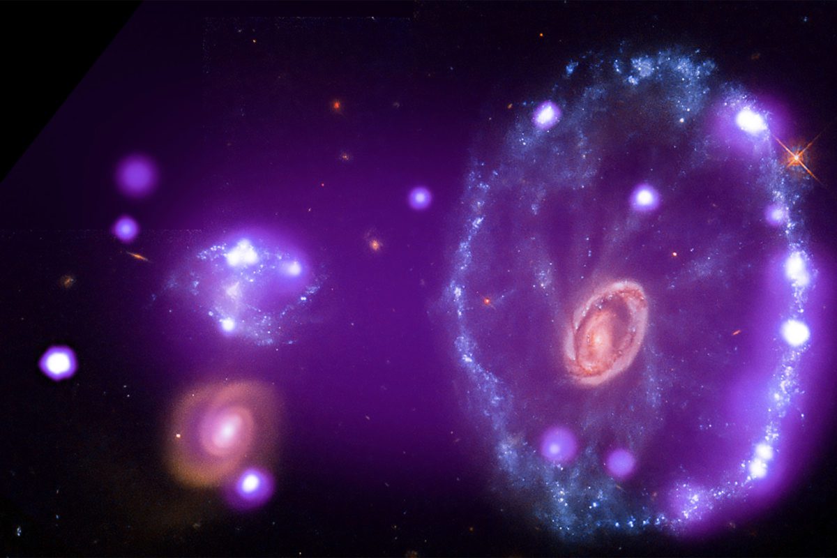 A purple bullseye in space that is the Cartwheel Galaxy
