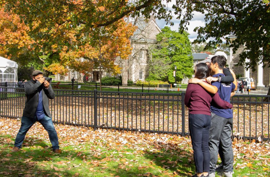A family with their arms around one another is photographed by Patrick Montero.