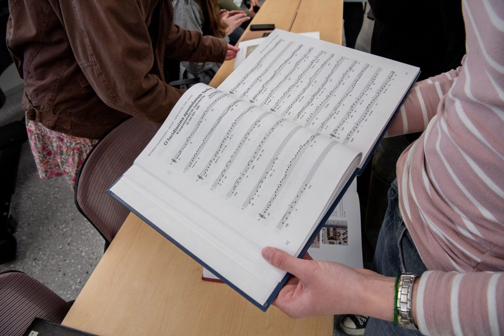 A student holds a score in the Music Library
