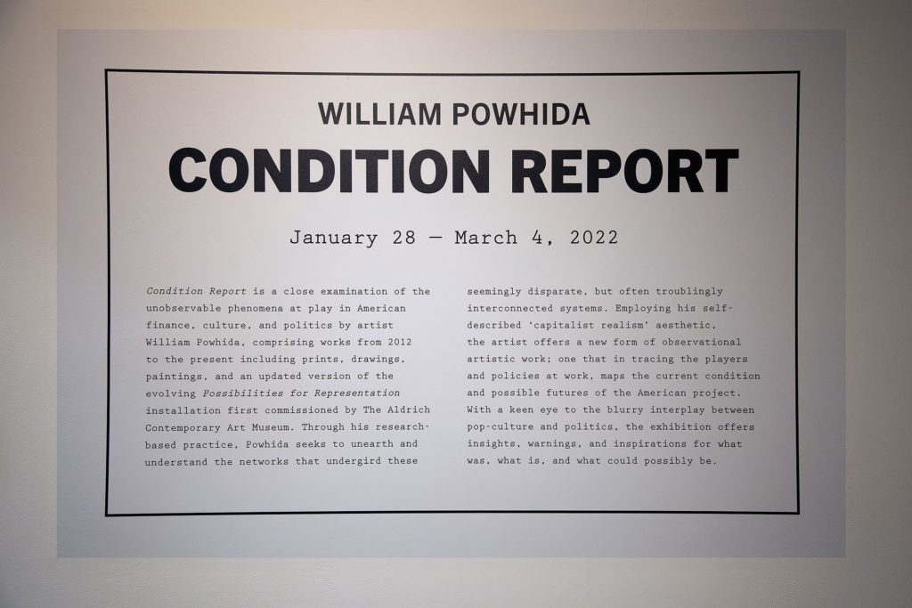 The title card reads "Condition Report is a close examination of the unovservable phenomena at play in American finance, culture, adn politics by artist William Powhide, comprising workds from 2012 to the present, inclduing prints, dawings, paintings, and an updated version of the evolving Possibilities for Representation installation first commissioned by the Aldrich Contemporary Art Museum.