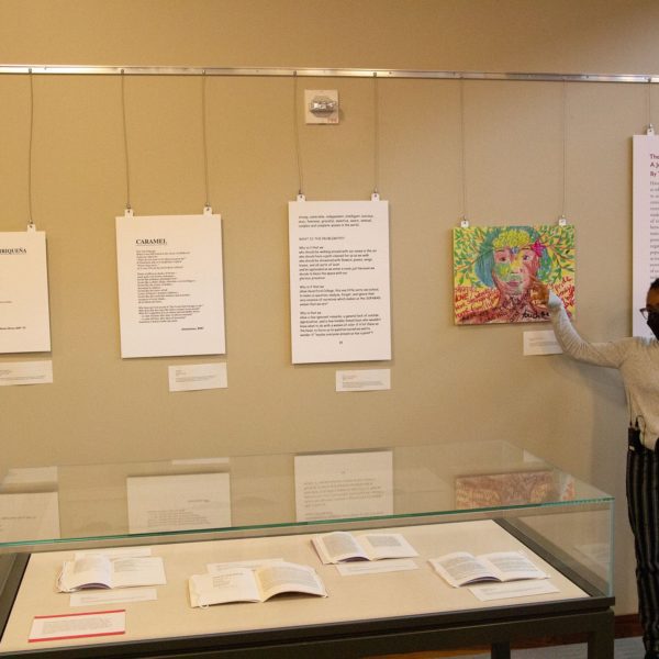 Taliyah Evans explains poetry on the exhibit wall.