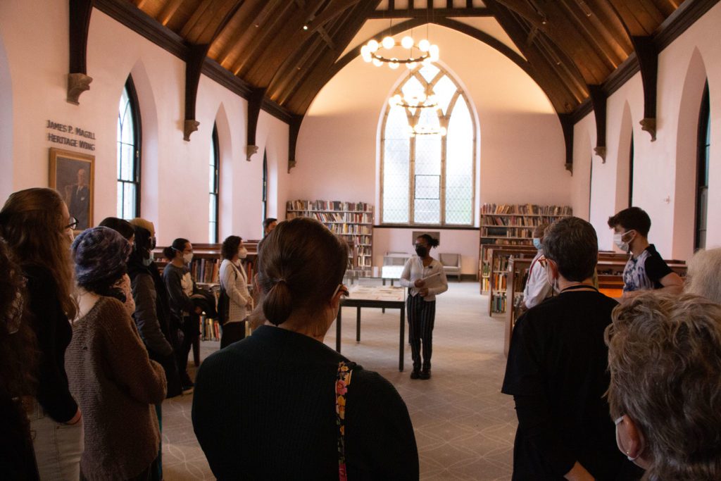 Taliyah Evans '24 explains one of the cases in the James P. Magill Heritage Wing.