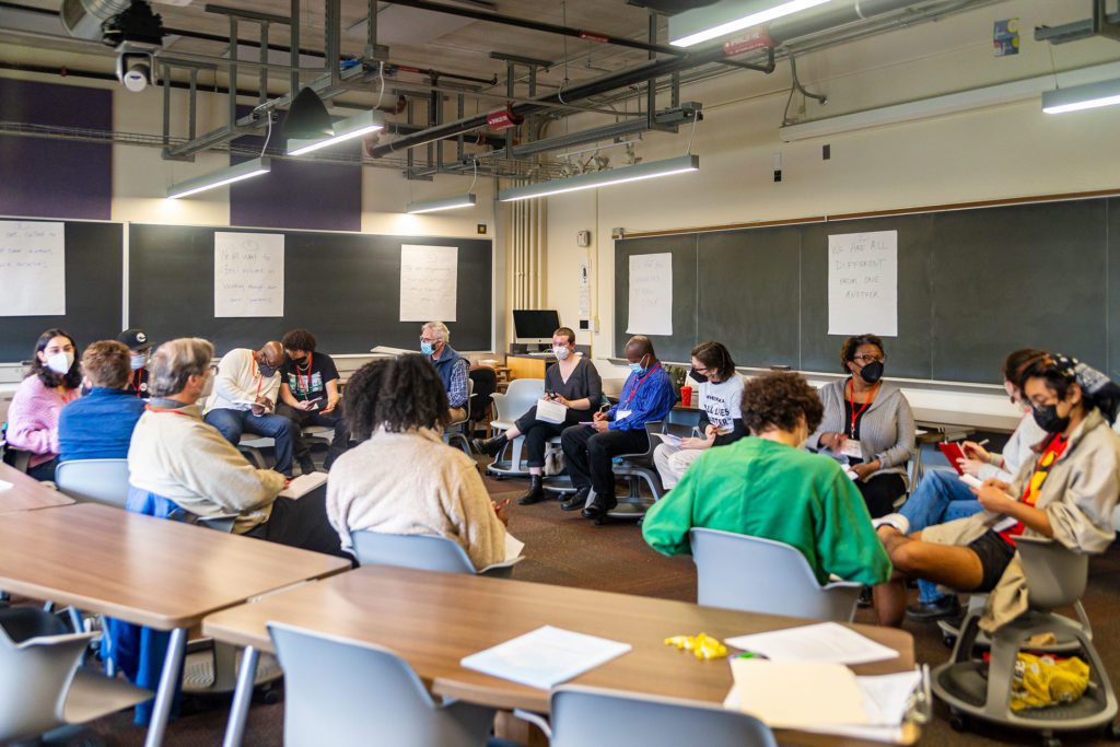 Conference attendees sit in a circle and discuss in “Race & Restorative Justice (Part 1)."