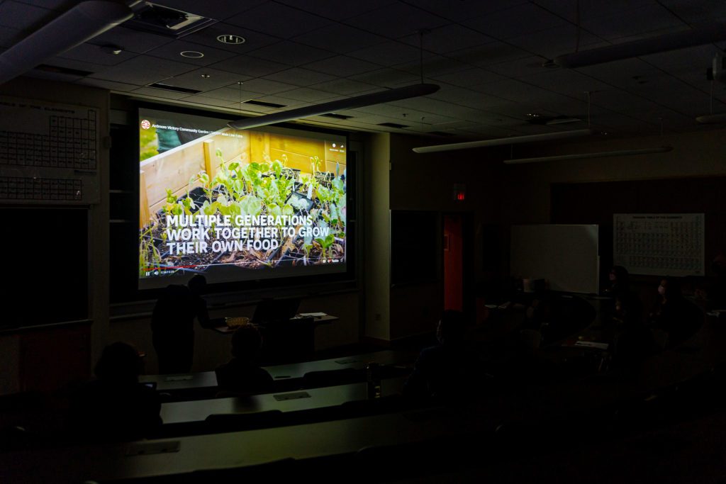Attendees watch a video about Ardmore's Community Garden during a presentation.