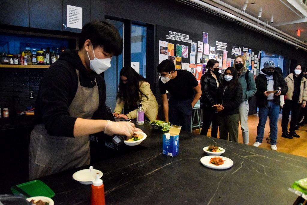 Participants wait in line to make bibimbap.