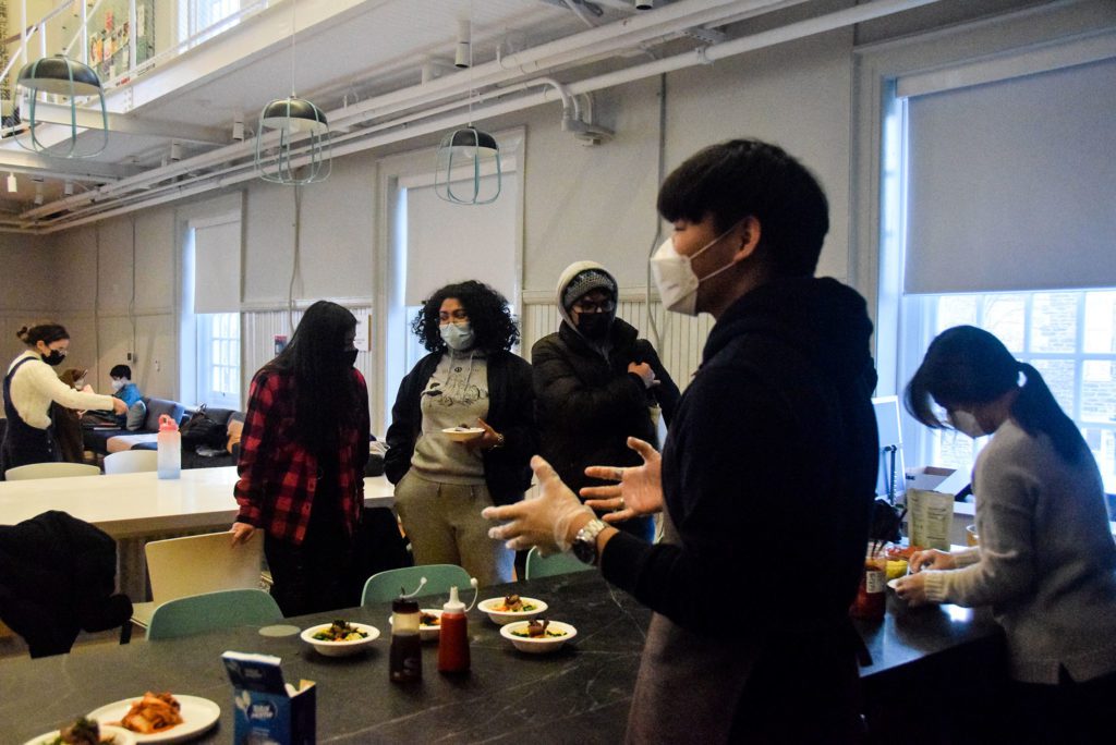 Yehyun Song '25 explains bibimbap to participants.