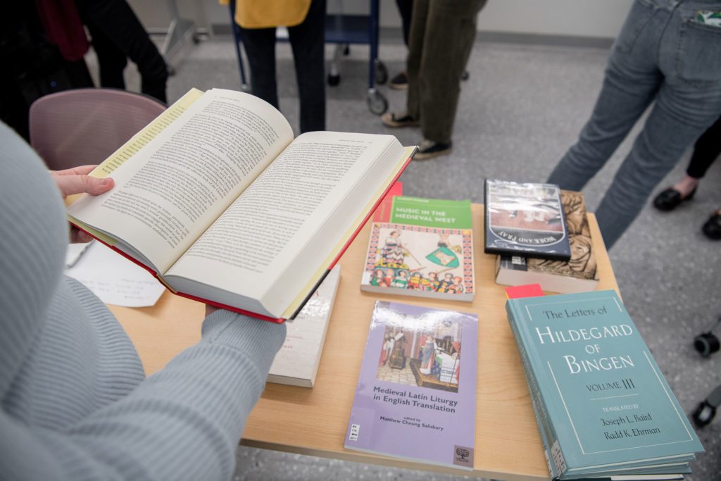 A spread of books including "The Letters of Hildegard of Bingen Vol. III" and "Medieval Latin Liturgy in English Translation"