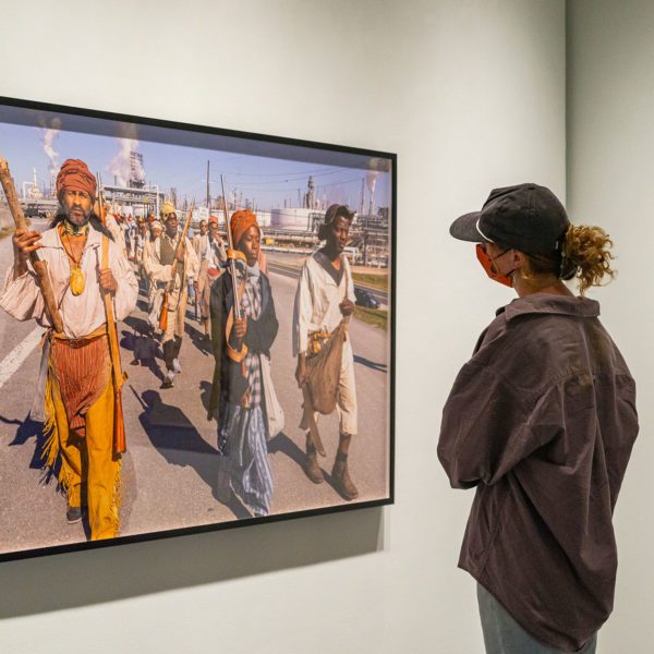 Student observing Dread Scott's work.