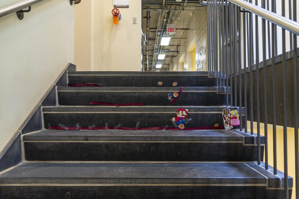 Donkey Kong characters glued to the stairs.
