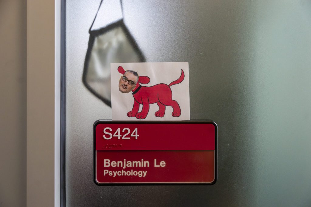 Ben Le's head on Clifford the Big Red Dog's body on his office door.