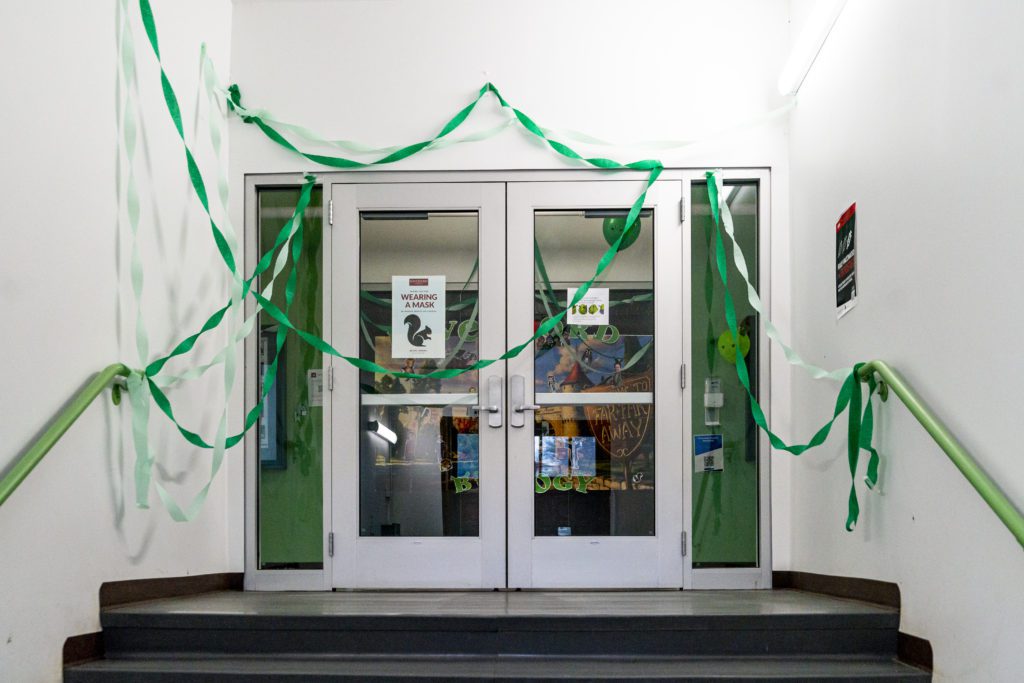 Green streamers cover the doors to the biology deparment