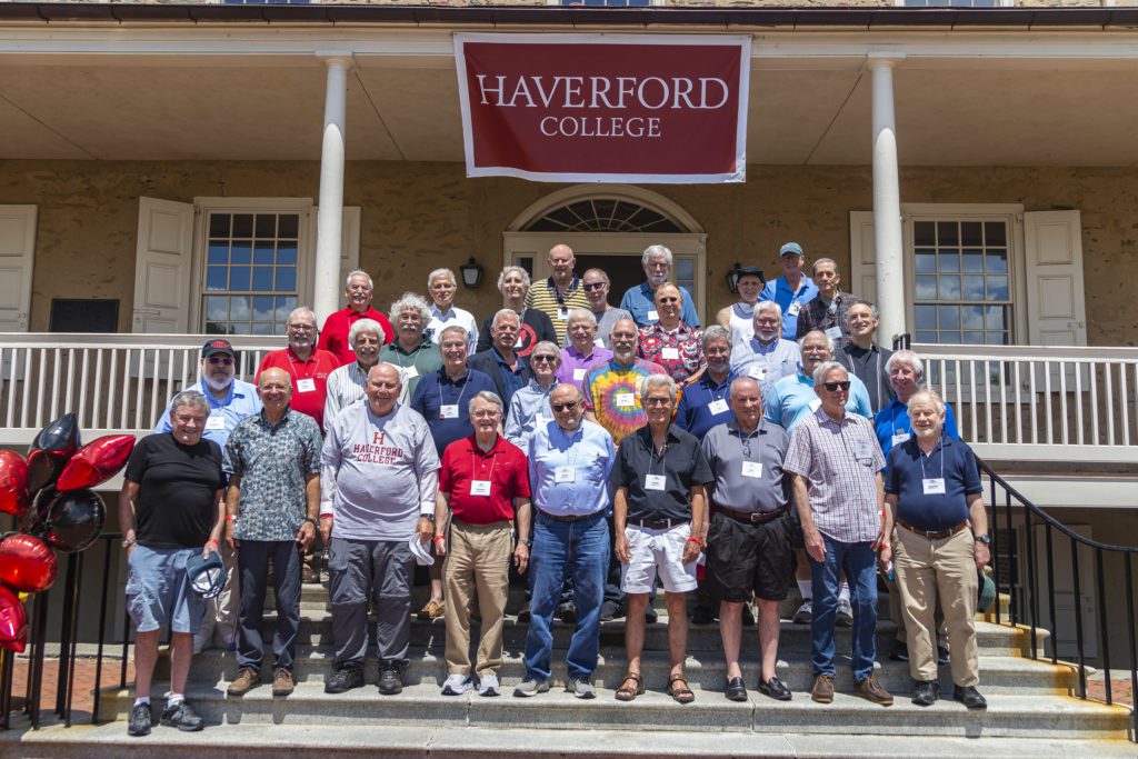About 30 members of the Class of 1971 belatedly celebrate their 50th reunion in this class photo under a Haverford banner.