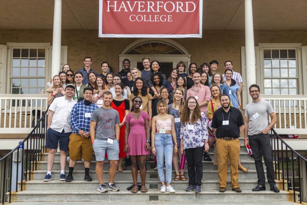 About 50 members of 5-year reunion class pose in their casual summer clothes under a Haverford College banner.