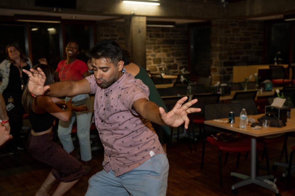 An alum dances inside the DC.