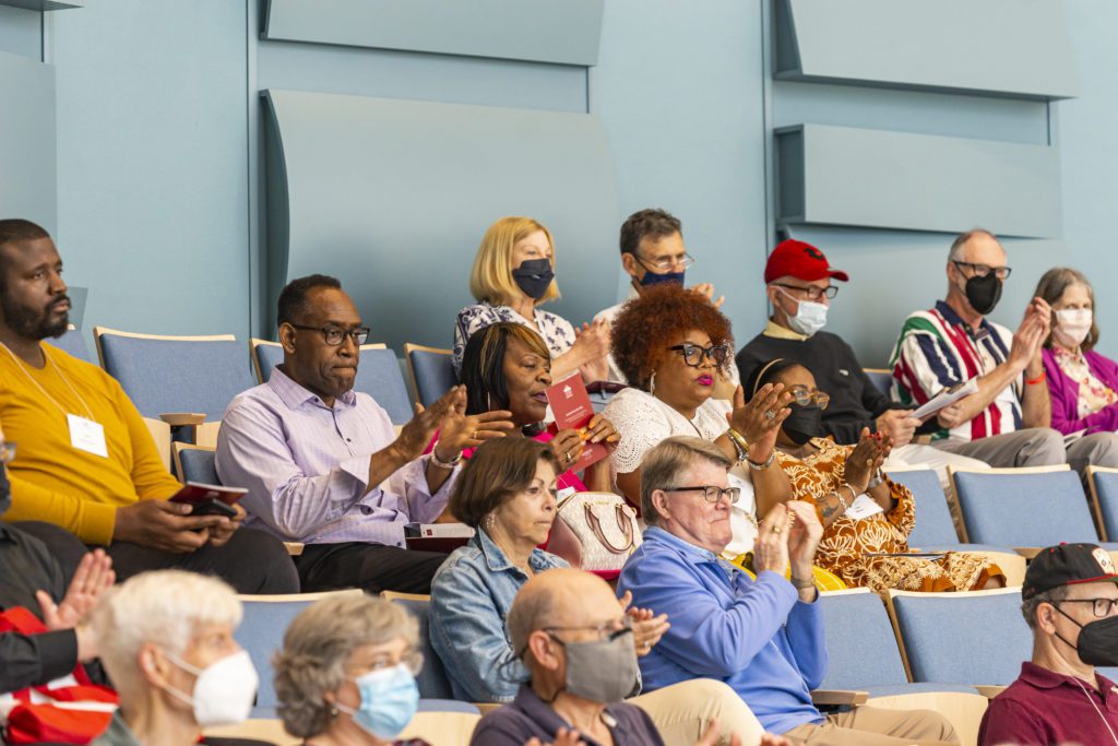 Friends and relatives in the audience at the Alumni Association Awards clap.