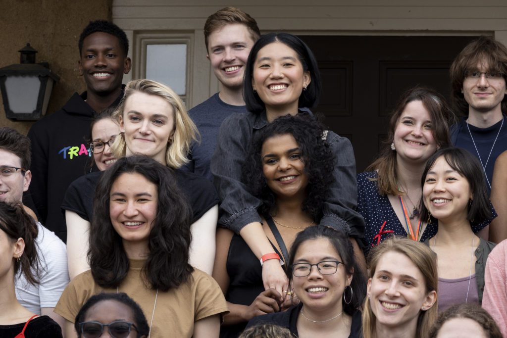A close-up on about 10 Class of 2017 members including two who have their arms around each other.